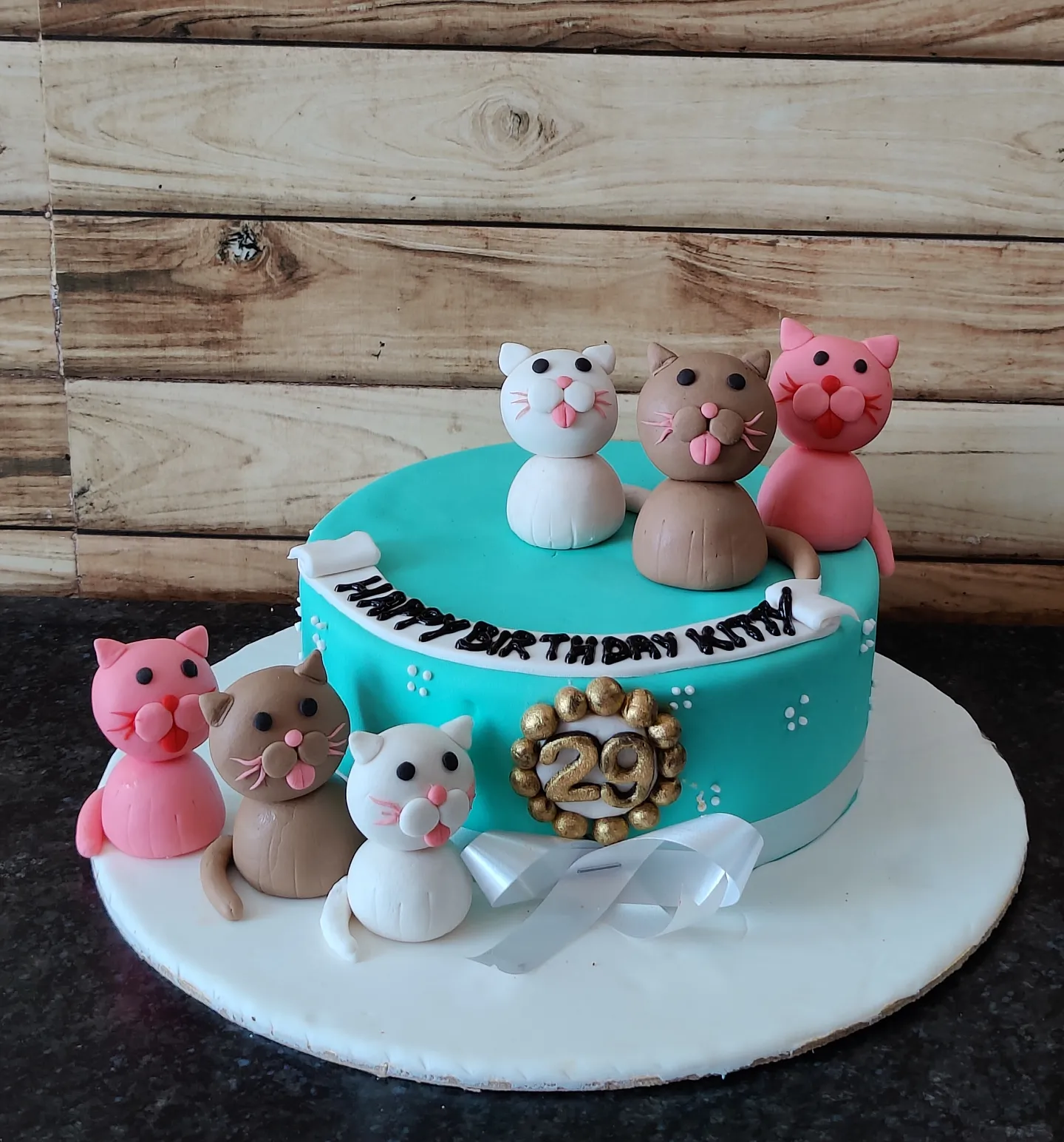 cat figures turquoise pink